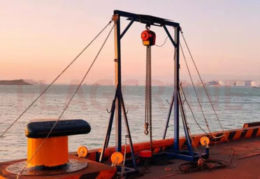 Simple mobile gantry cranes are used for boarding ladders in port